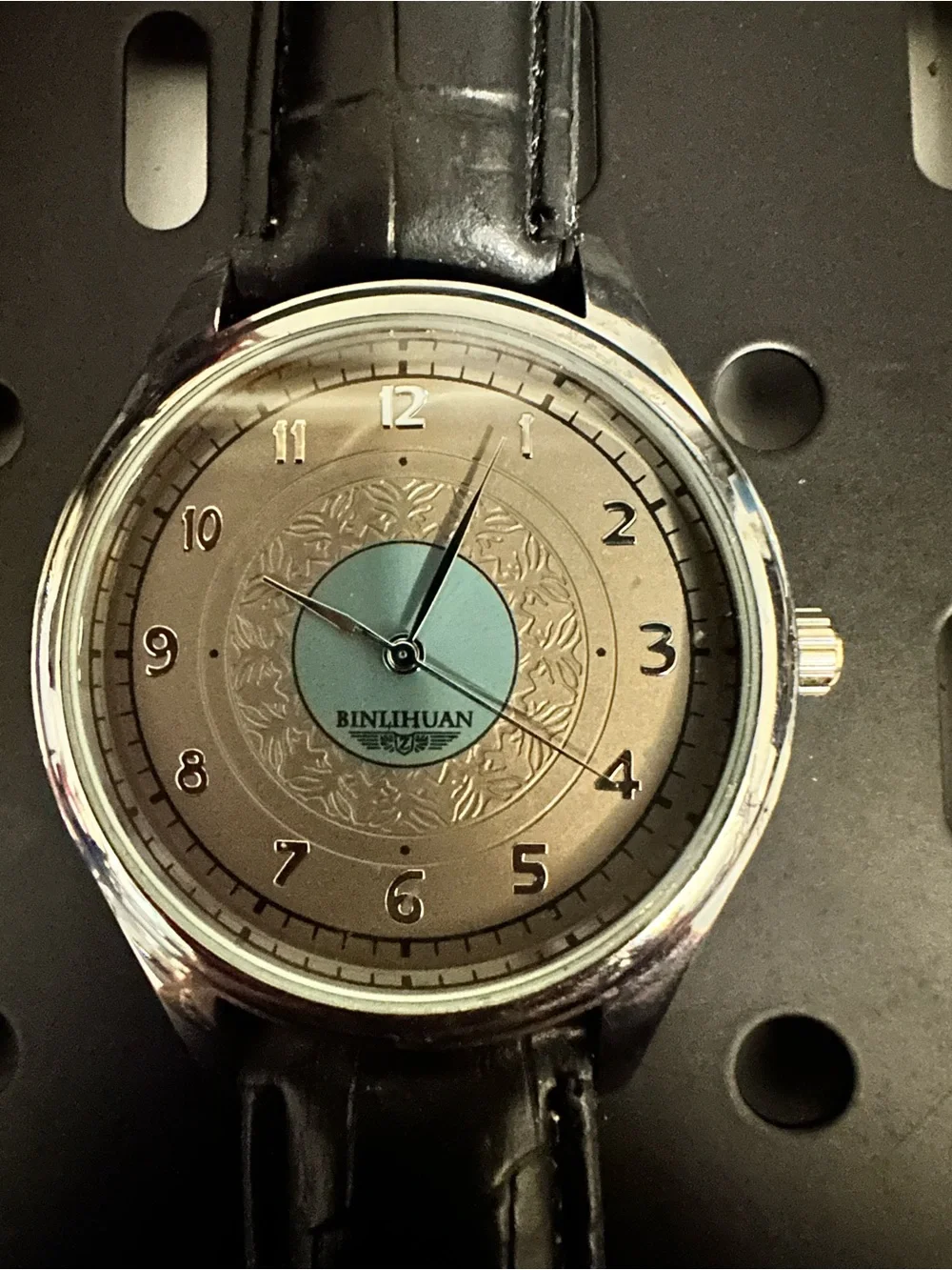 Men's Silver Watch with Black Leather Strap and Light Blue Dial Accent